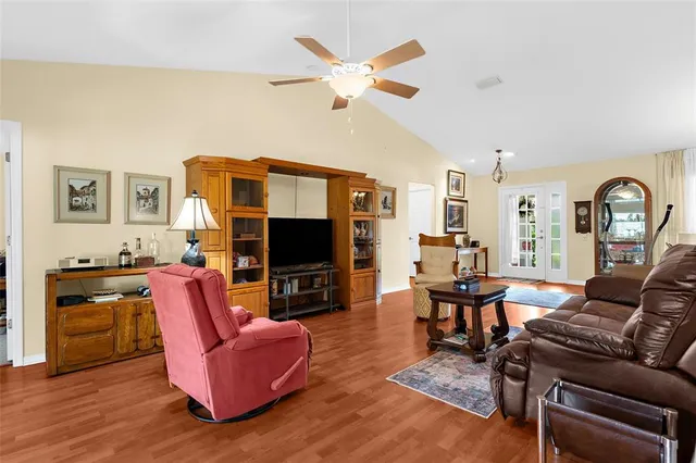 a living room with furniture fireplace and a flat screen tv