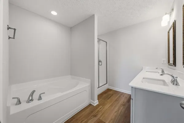 a bathroom with a bathtub and a sink