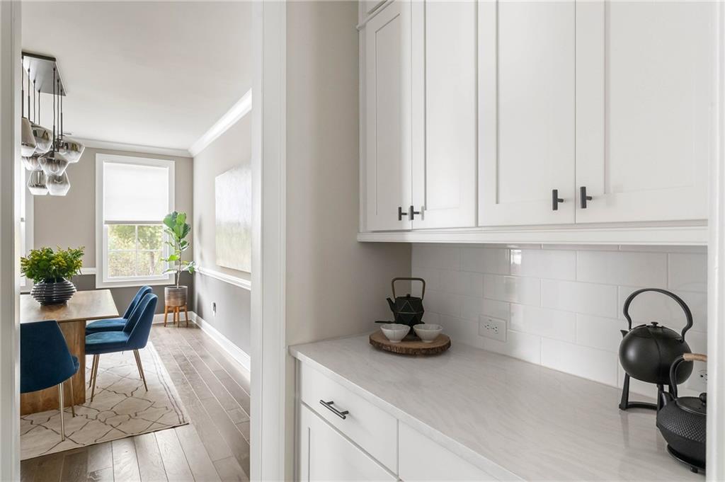 550 Central Park Overlook Alpharetta, GA 30004 - Photo 13 of 51 a view of a kitchen with dining table and chairs