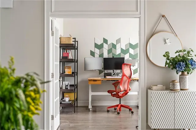 a bathroom with a sink mirror and a window