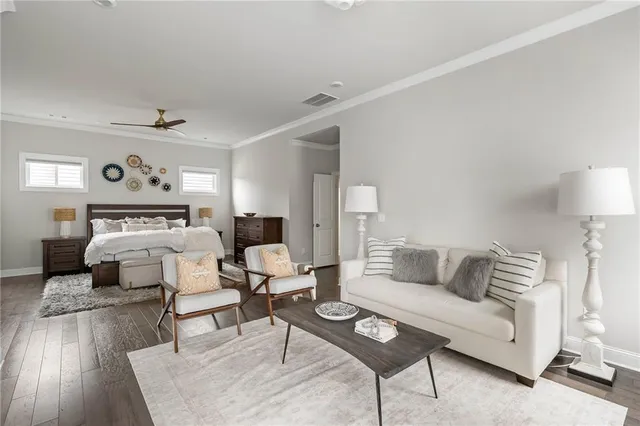 a bedroom with a bed and a couch