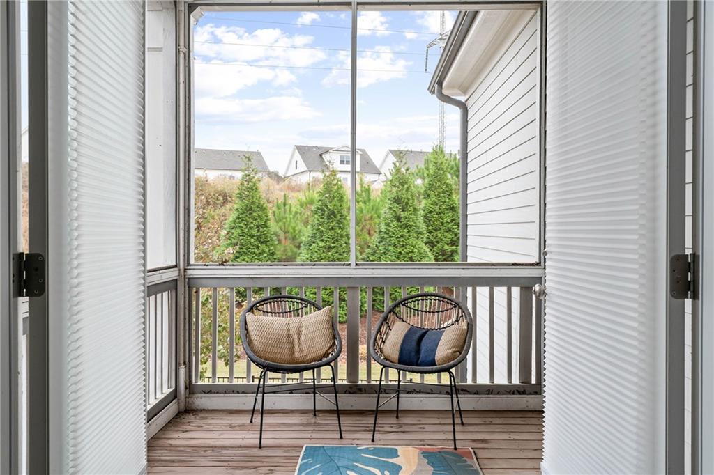 550 Central Park Overlook Alpharetta, GA 30004 - Photo 25 of 51 a view of a balcony with chairs and wooden floor