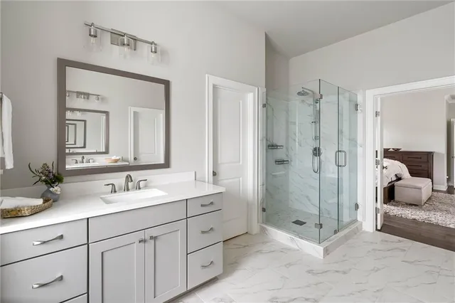 a bed room with a bed and a painting on the wall