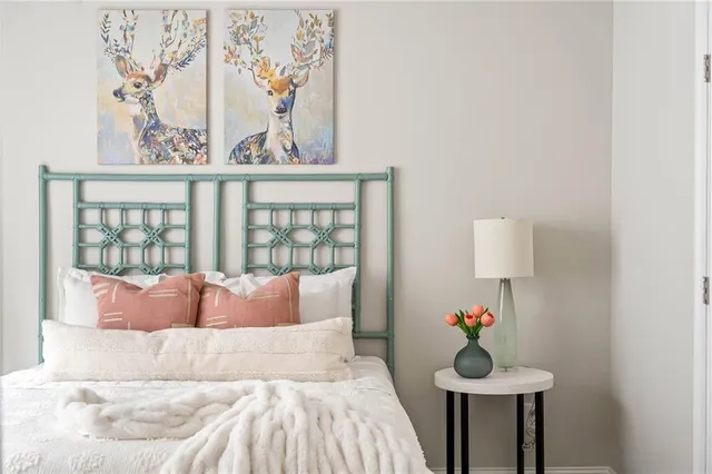 a bedroom with bed and a window