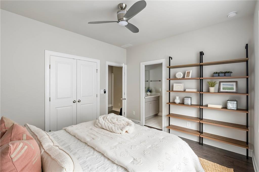 550 Central Park Overlook Alpharetta, GA 30004 - Photo 31 of 51 a bedroom with a bed and closet