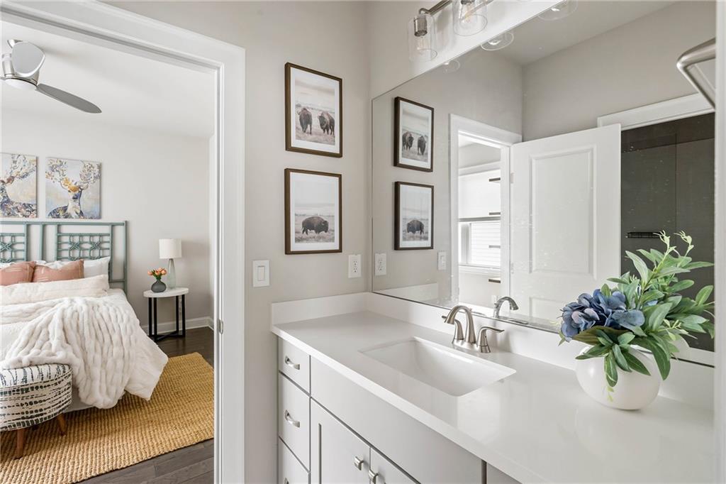 550 Central Park Overlook Alpharetta, GA 30004 - Photo 32 of 51 a bedroom with a bed and a sink