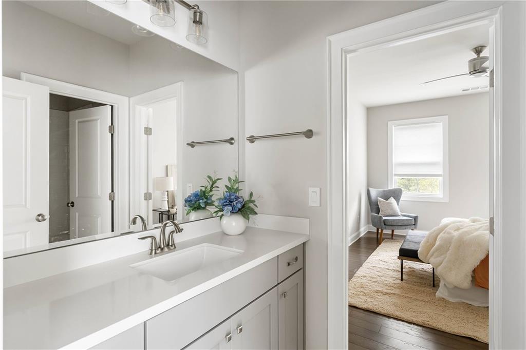 550 Central Park Overlook Alpharetta, GA 30004 - Photo 33 of 51 a living room with furniture and a mirror