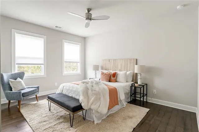 a bedroom with a bed chair and couch