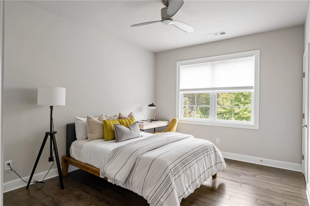 550 Central Park Overlook Alpharetta, GA 30004 - Photo 36 of 51 a bedroom with bed and window
