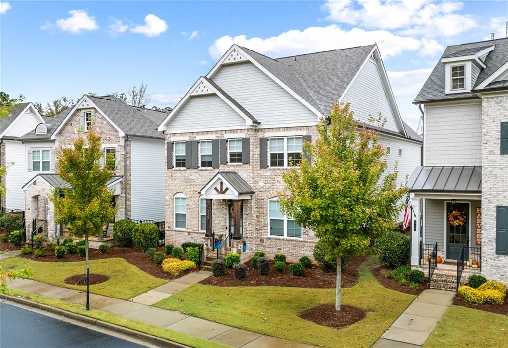 550 Central Park Overlook Alpharetta, GA 30004 - Photo 43 of 51 a front view of a house with garden