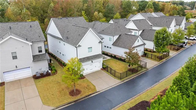 an aerial view of residential house with outdoor space and swimming pool
