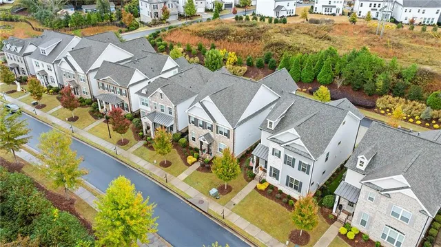 an aerial view of a house with a yard and garden
