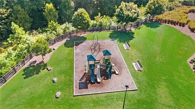 a view of a playground with basketball court