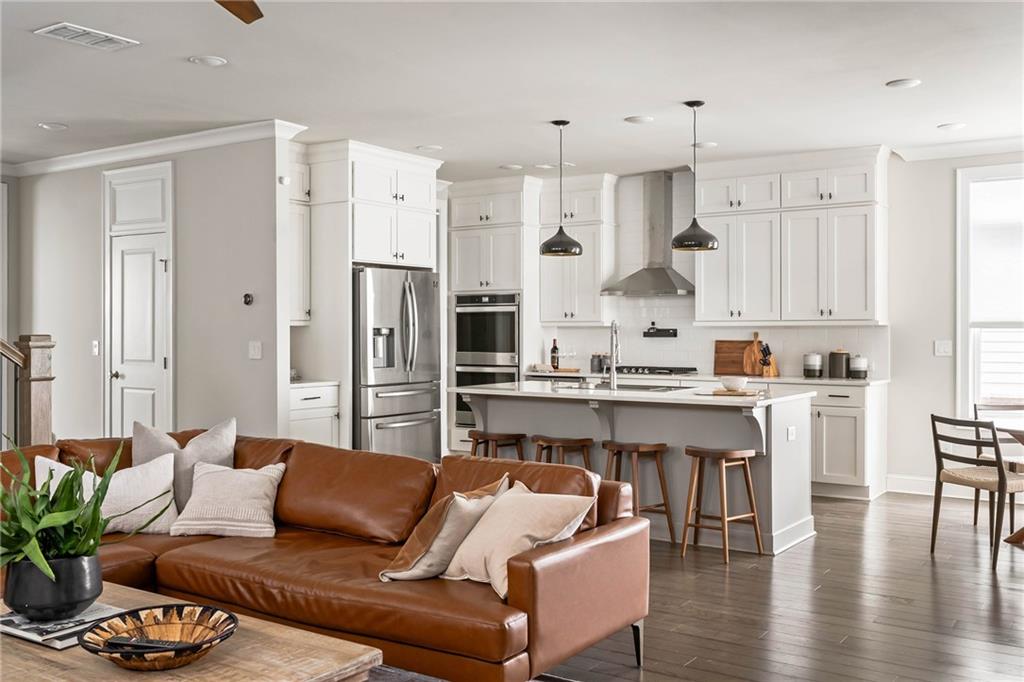 550 Central Park Overlook Alpharetta, GA 30004 - Photo 7 of 51 a living room with stainless steel appliances kitchen island granite countertop furniture and a large window