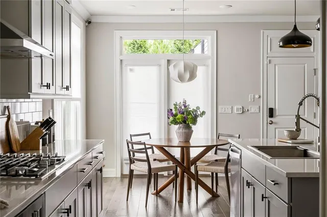 a dining room with furniture and window