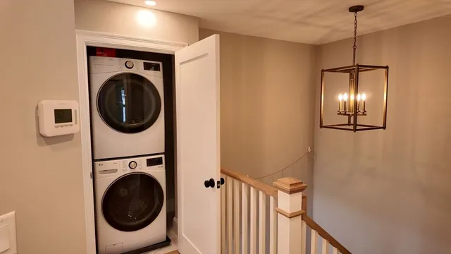 a view of a hallway with washer and dryer