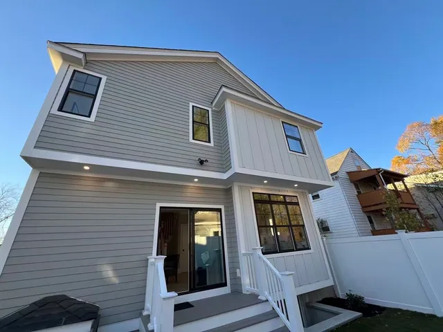 a front view of a house with glass windows