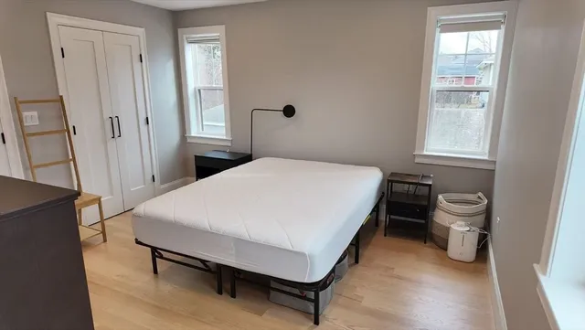 a bedroom with a bed and a table