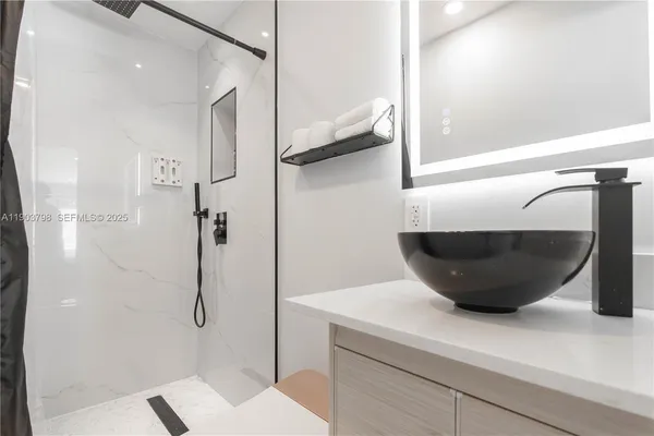 a bathroom with a shower and a toilet