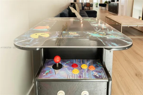 a large bed sitting in a bedroom next to a window