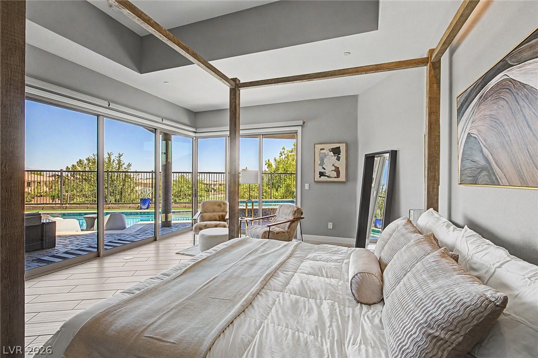 6014 Willow Ridge Court Las Vegas, NV 89135 - Photo 41 of 99 This serene bedroom offers expansive views of the outdoor pool area.