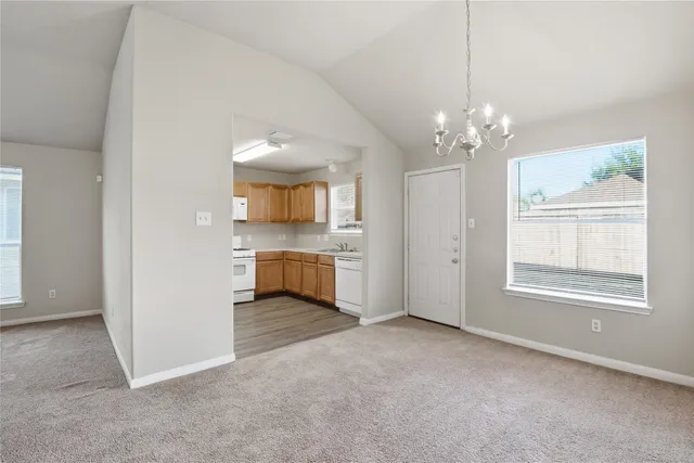 a view of a kitchen with a sink and dishwasher cabinet
