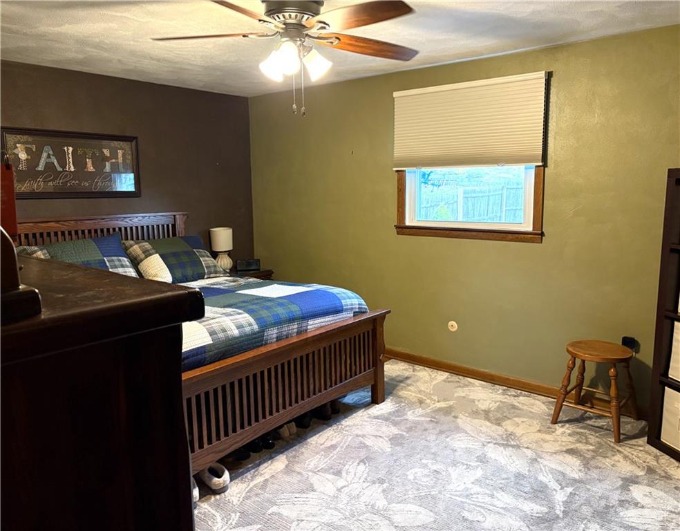5719 Halchess Street Pittsburgh, PA 15207 - Photo 12 of 25 a bedroom with a bed and a table