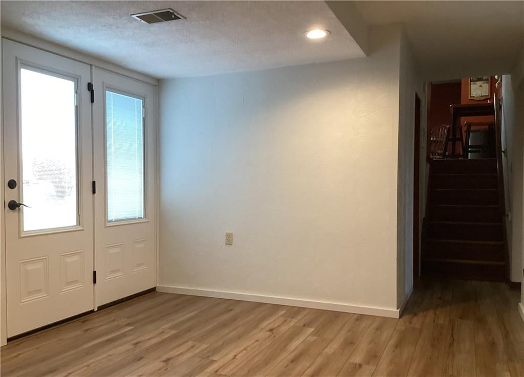 5719 Halchess Street Pittsburgh, PA 15207 - Photo 19 of 25 an empty room with wooden floor and windows