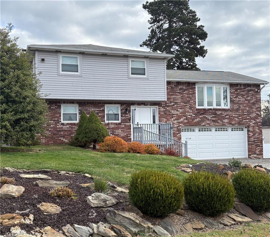 5719 Halchess Street Pittsburgh, PA 15207 - Photo 2 of 25 front view of a house with a yard