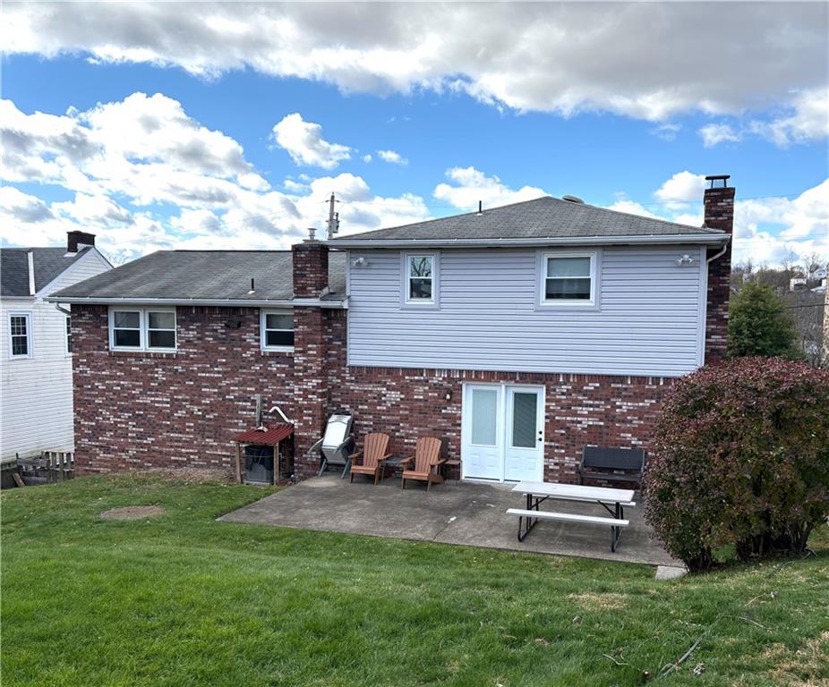 5719 Halchess Street Pittsburgh, PA 15207 - Photo 23 of 25 a front view of a house with a yard
