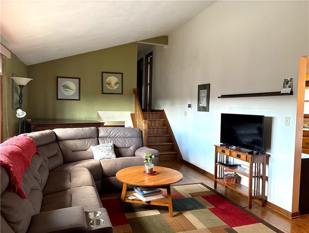 5719 Halchess Street Pittsburgh, PA 15207 - Photo 6 of 25 a living room with furniture and a flat screen tv