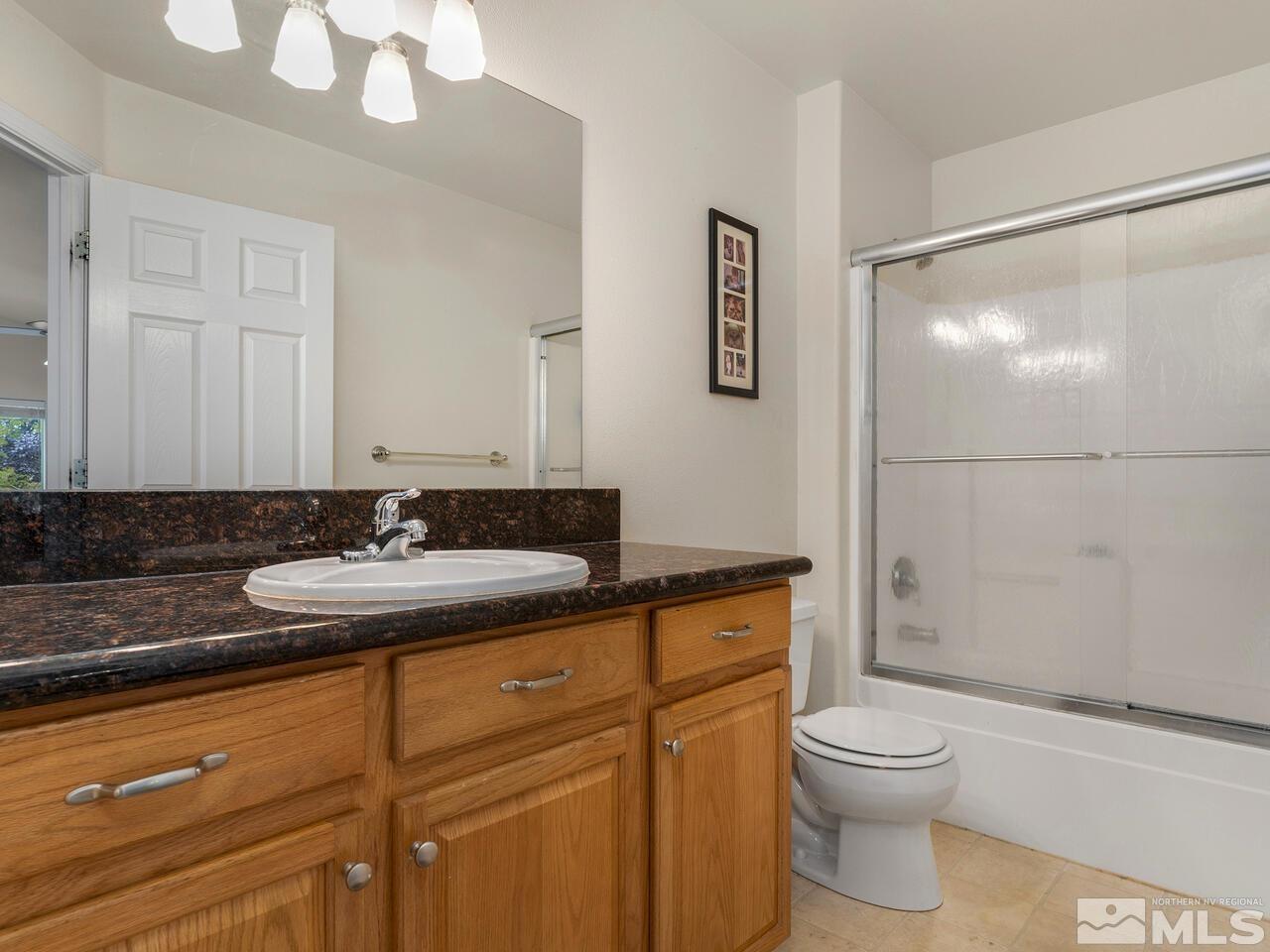 160 Hoge Road Reno, NV 89506 - Photo 12 of 19 a bathroom with a sink a toilet and shower