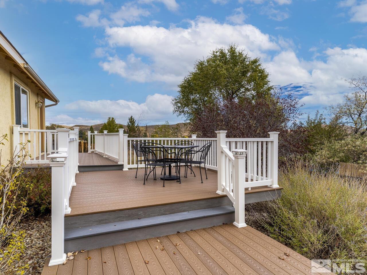 160 Hoge Road Reno, NV 89506 - Photo 15 of 19 a view of a roof deck with table and chairs and wooden floor