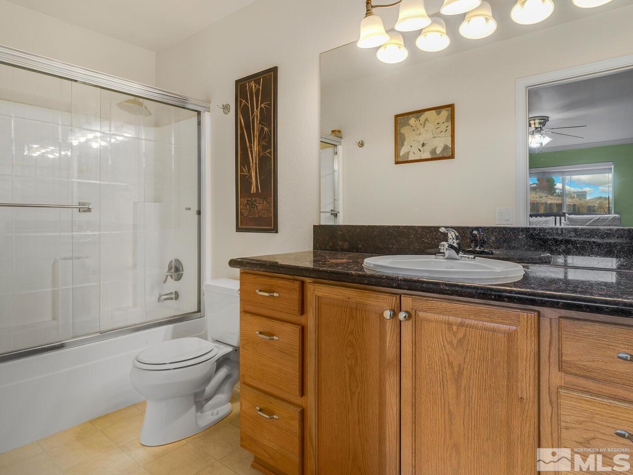 160 Hoge Road Reno, NV 89506 - Photo 9 of 19 a bathroom with a granite countertop sink toilet and shower