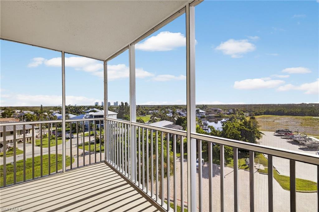 5900 Bonita Beach Road Southwest, Unit 1602 Bonita Springs, FL 34134 - Photo 16 of 26 Balcony with a sunroom and a water view