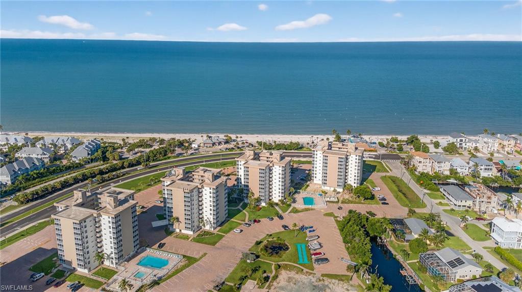 5900 Bonita Beach Road Southwest, Unit 1602 Bonita Springs, FL 34134 - Photo 19 of 26 Aerial view of property and surrounding area with waterfront with a beach