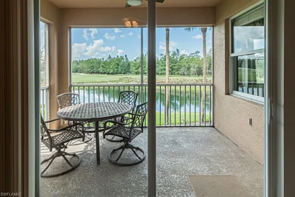 a balcony view with a garden space and patio