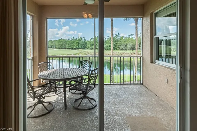 a balcony view with a garden space and patio