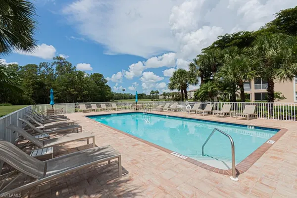 a view of a lake with houses in the back
