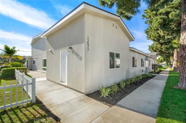 a backyard of a house with outdoor seating
