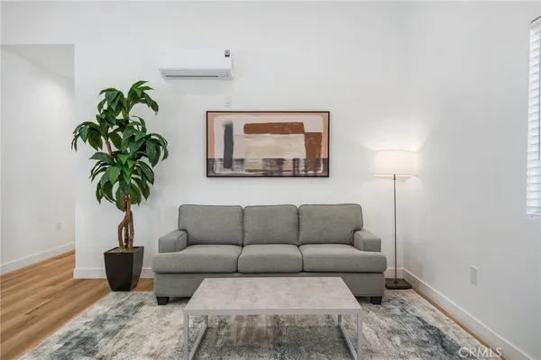a view of kitchen with furniture and wooden floor