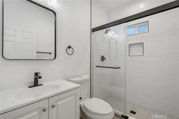 a kitchen with stainless steel appliances a sink and cabinets