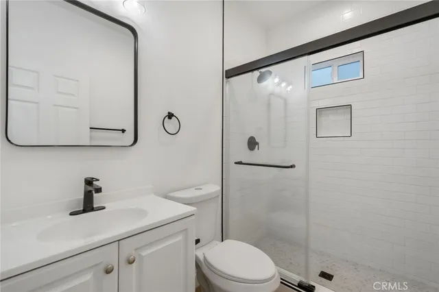 a kitchen with stainless steel appliances a sink and cabinets