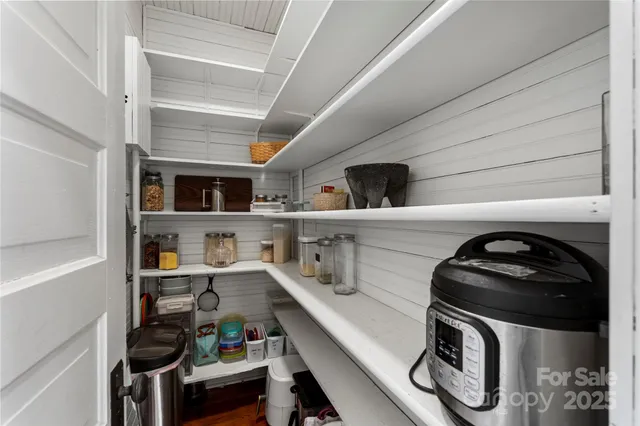 a kitchen with a stove and cabinets