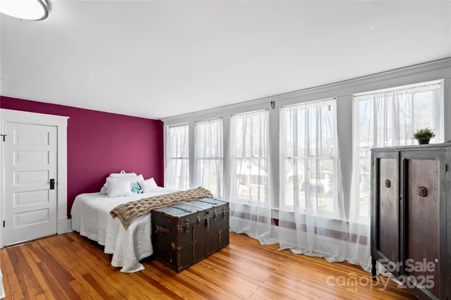 a bed room with a bed and a window