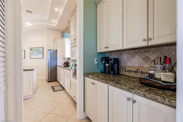a kitchen with stainless steel appliances granite countertop a lot of counter top space and cabinets