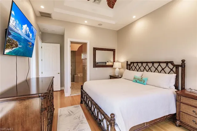 a bedroom with a bed and a view of bathroom