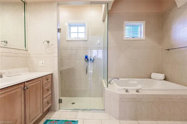 a bathroom with a bathtub and a shower