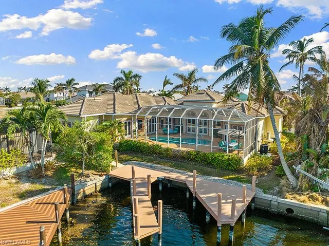 a view of house with yard and sitting area