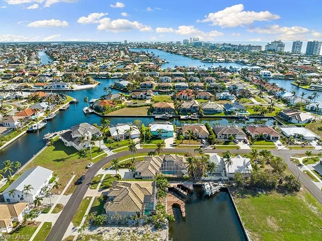 an aerial view of residential houses with outdoor space